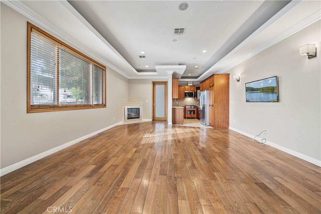 216 North Buena Vista Street Burbank, CA 91505 - Photo 5 of 22 a view of empty room with wooden floor and fan