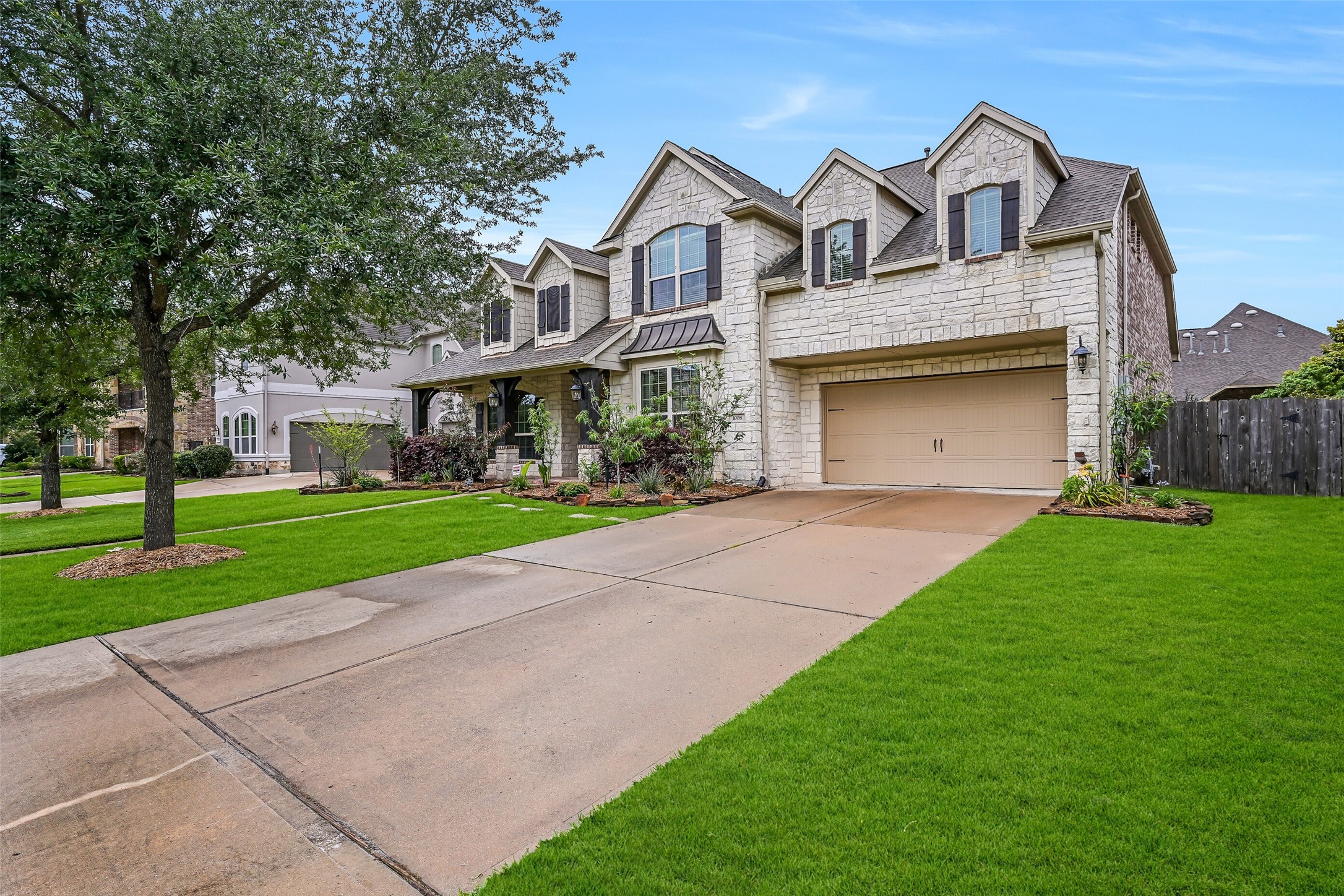 1008 Point Isabel Lane Friendswood, TX 77546 - Photo 3 of 50 From the drive, take in the scale of this 4,295 square foot Village Builders Van Gough design, offering a spacious two-story layout, generous parking, and a well-positioned homesite within this established Friendswood community.
