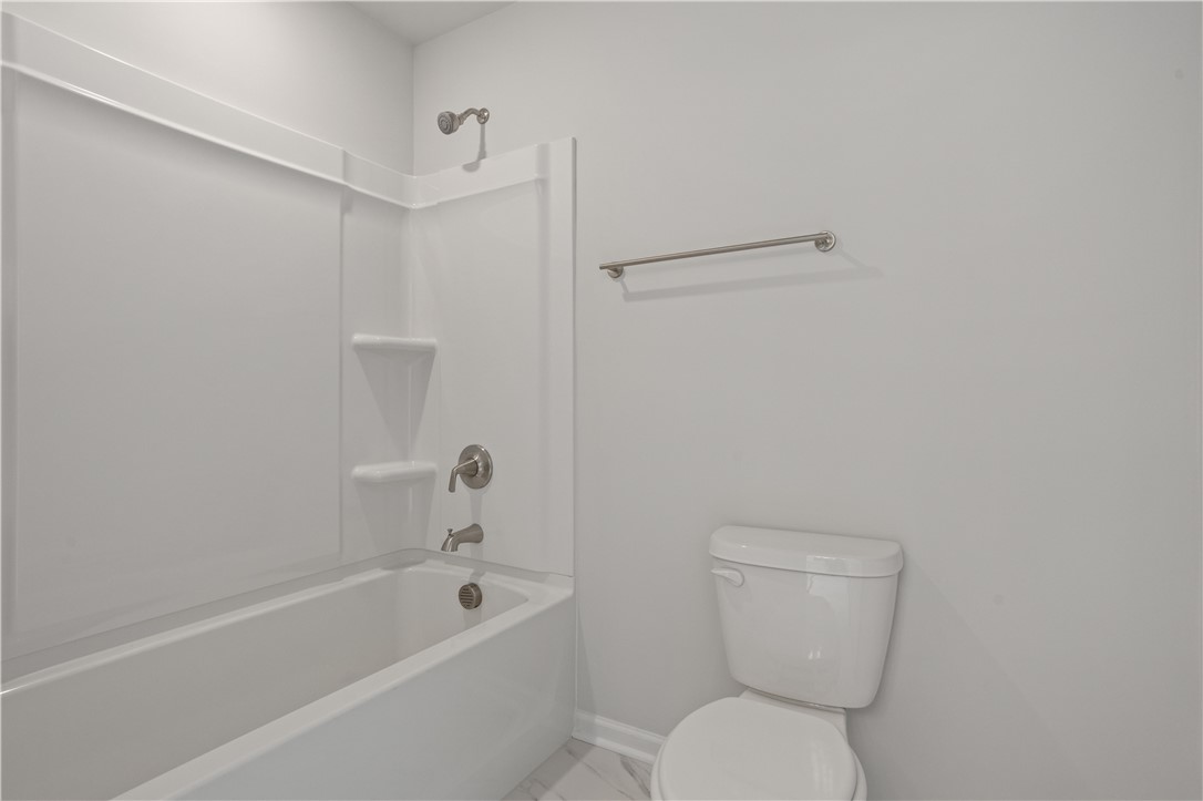 555 Hydrangea Street, Unit LOT 47 Seneca, SC 29678 - Photo 33 of 38 A well-appointed bath features a sleek shower-tub combination and classic commode.