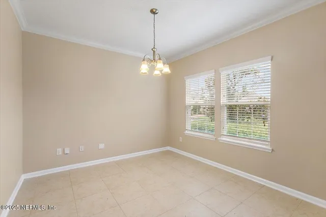 a view of a room with windows and chandelier