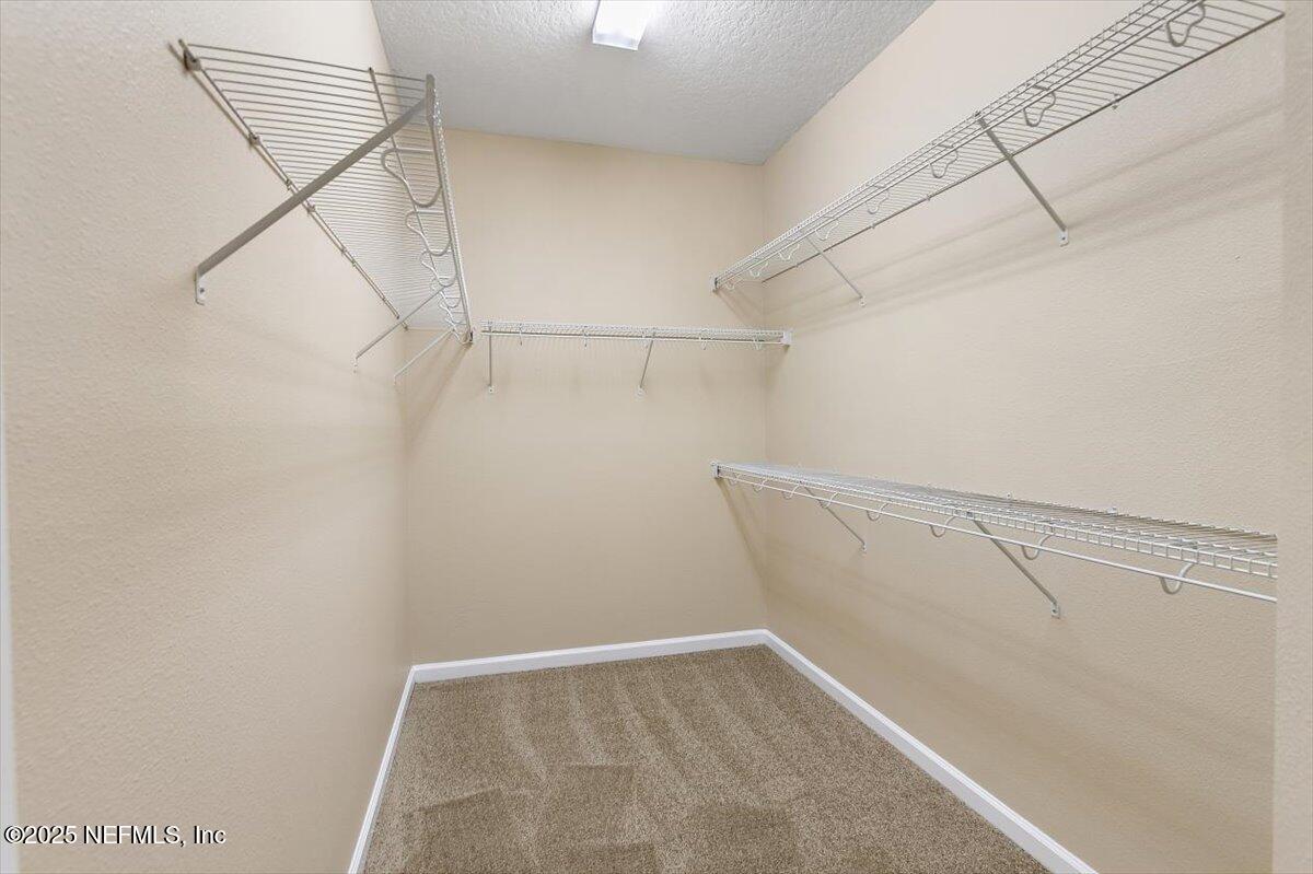 165 Crown Colony Road St. Augustine, FL 32092 - Photo 14 of 25 a view of a room with racks on the wall