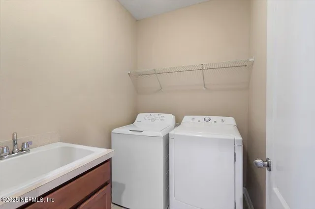 a utility room with dryer and washer