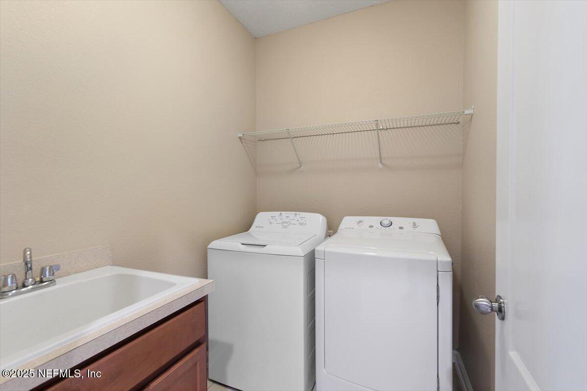 165 Crown Colony Road St. Augustine, FL 32092 - Photo 18 of 25 a utility room with dryer and washer