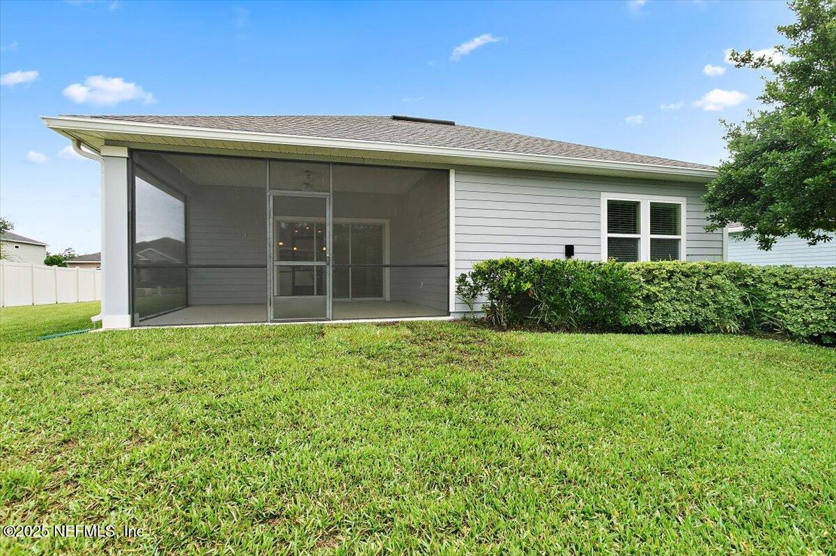 165 Crown Colony Road St. Augustine, FL 32092 - Photo 20 of 25 a view of a house with a backyard