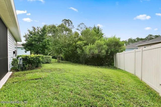 a view of sign board with flower around