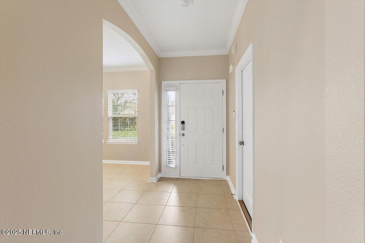 165 Crown Colony Road St. Augustine, FL 32092 - Photo 4 of 25 an empty room with windows and closet