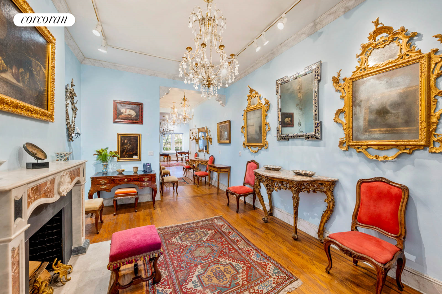 36 East 73rd Street Manhattan, NY 10021 - Photo 8 of 31 a living room with furniture a fireplace and a chandelier