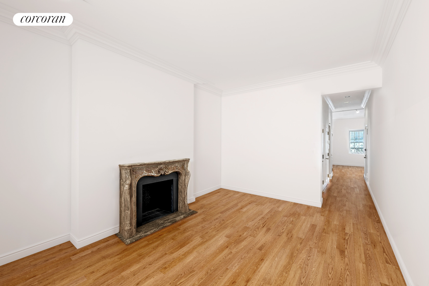 36 East 73rd Street Manhattan, NY 10021 - Photo 16 of 31 a view of empty room with wooden floor and fireplace
