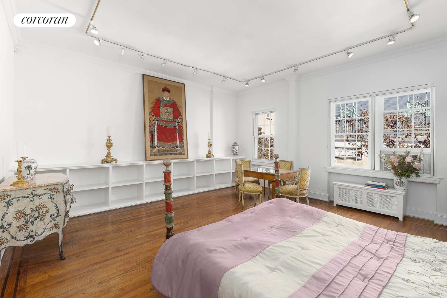 36 East 73rd Street Manhattan, NY 10021 - Photo 17 of 31 a bedroom with a bed and wooden floor