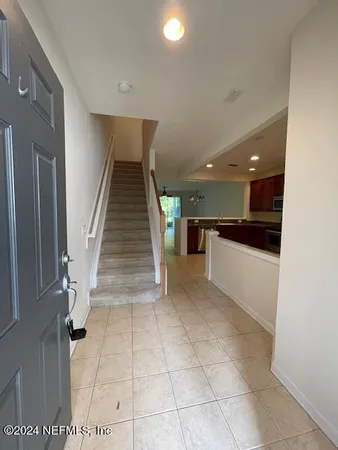 a kitchen with stainless steel appliances granite countertop a refrigerator and a stove