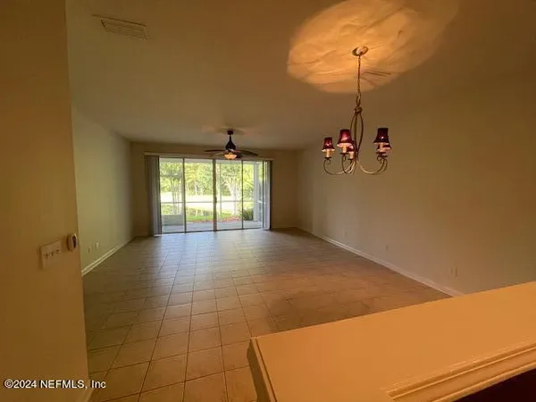 a kitchen with stainless steel appliances a refrigerator a stove a sink and a oven with wooden floor