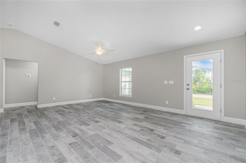 6 Cockpit Lane Placida, FL 33946 - Photo 12 of 20 wooden floor in an empty room with a window