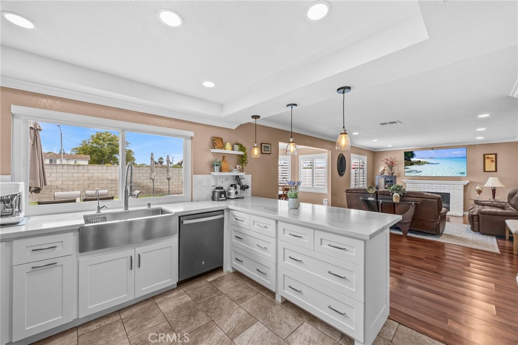 20257 Edmund Road Riverside, CA 92508 - Photo 13 of 53 a kitchen with white cabinets and sink