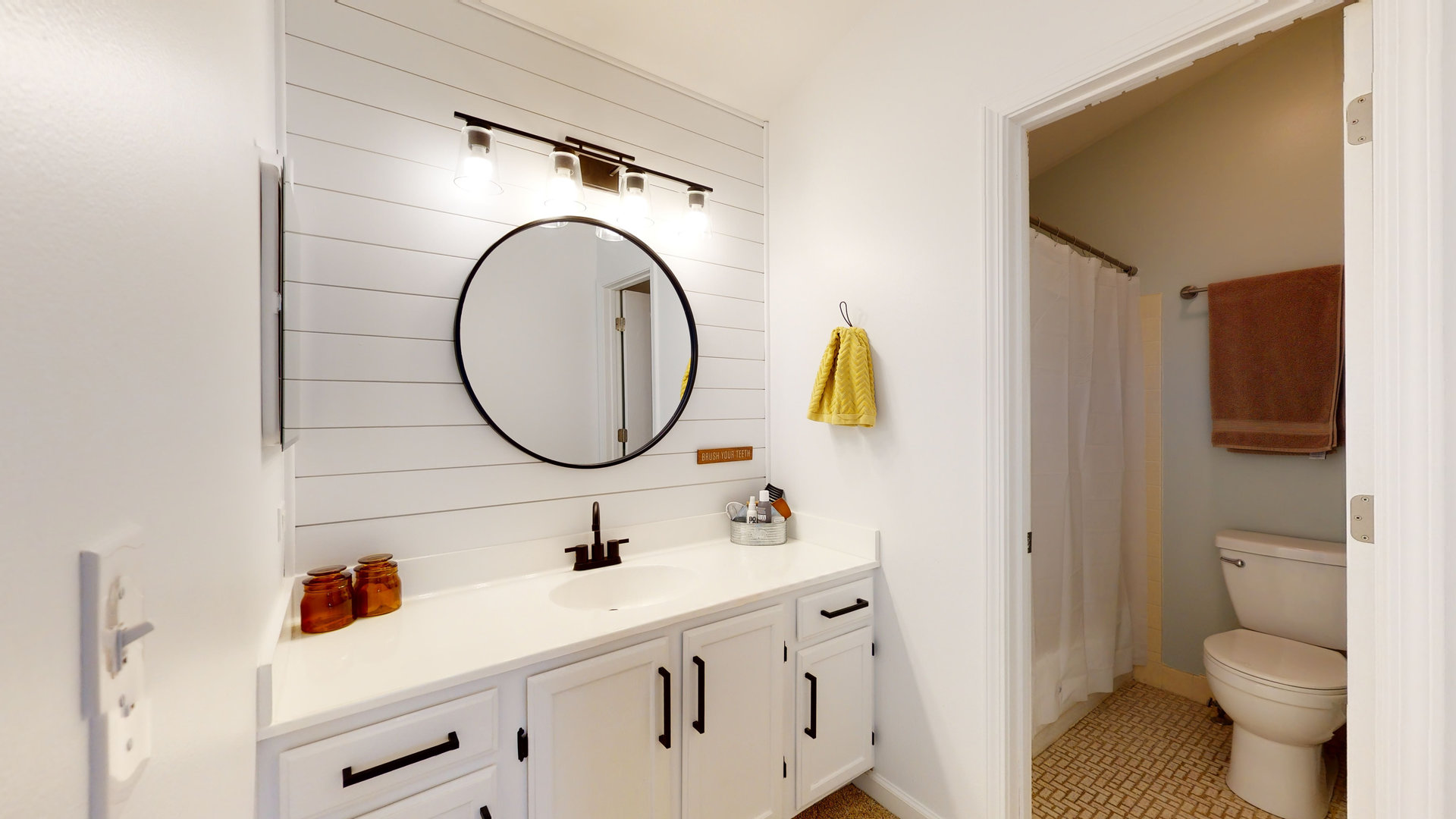 1017 Weeping Willow Drive Wheeling, IL 60090 - Photo 13 of 34 a bathroom with a sink and a mirror