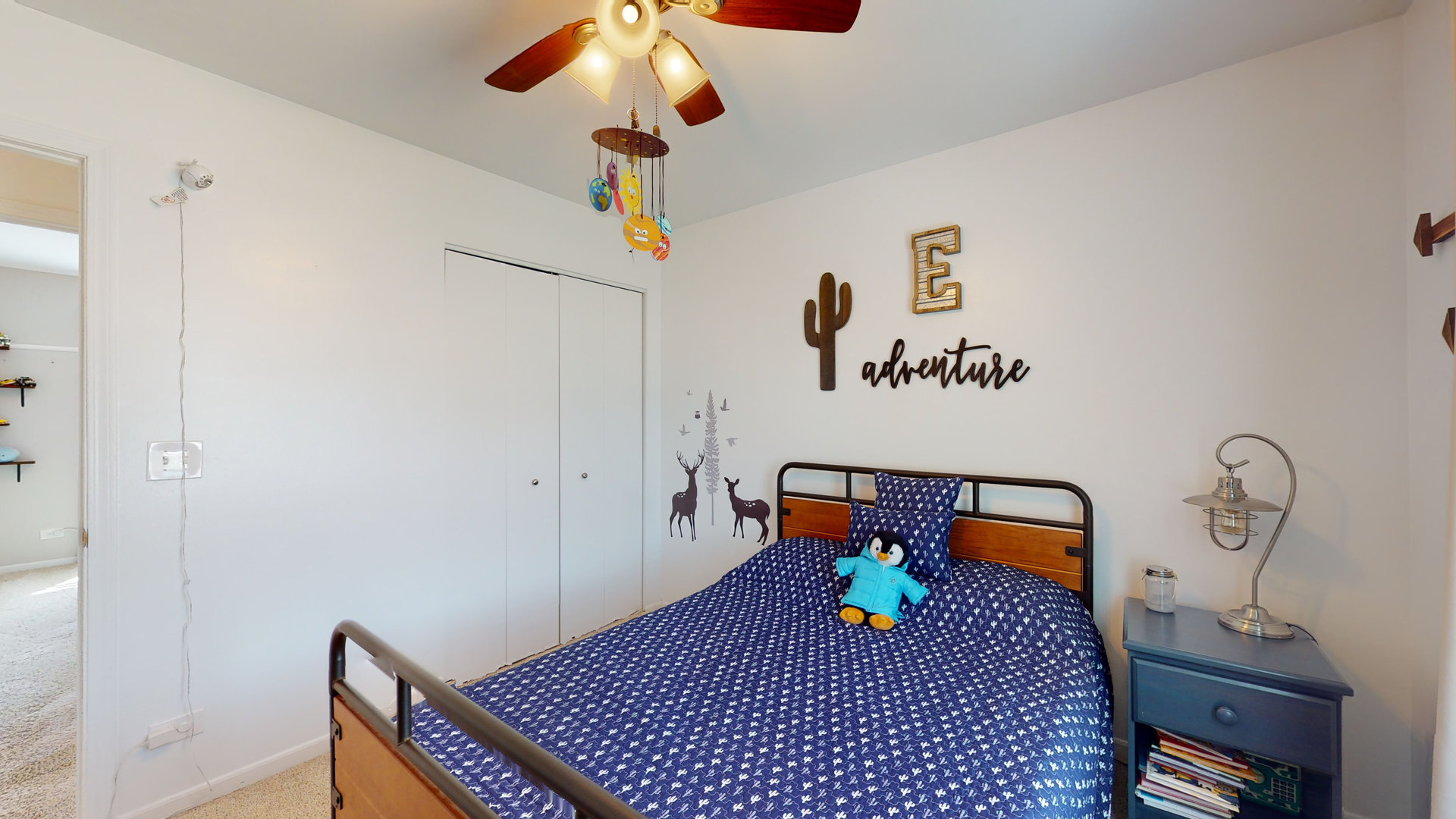 1017 Weeping Willow Drive Wheeling, IL 60090 - Photo 17 of 34 a bedroom with a bed and a chandelier