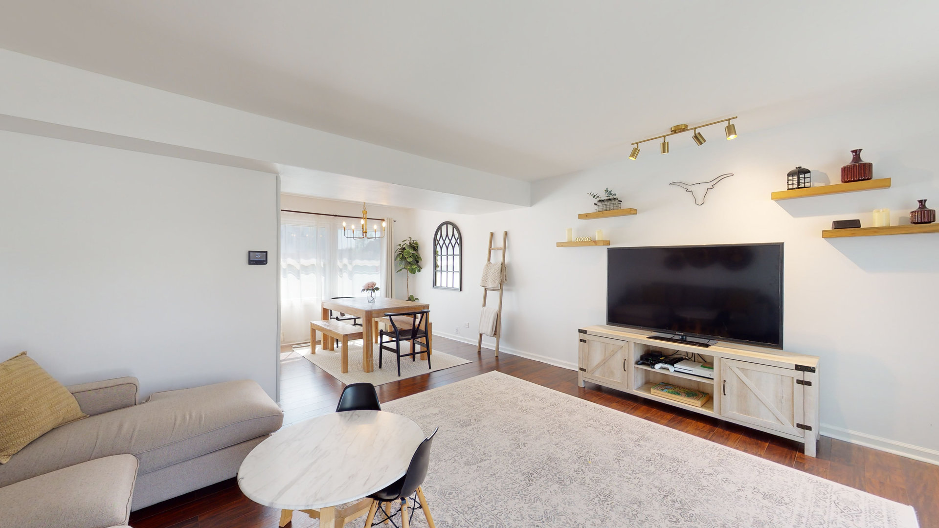 1017 Weeping Willow Drive Wheeling, IL 60090 - Photo 3 of 34 a living room with furniture and a flat screen tv