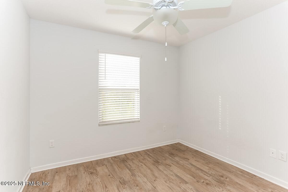 514 Eiseman Way Jacksonville, FL 32216 - Photo 12 of 15 an empty room with a window and a fan