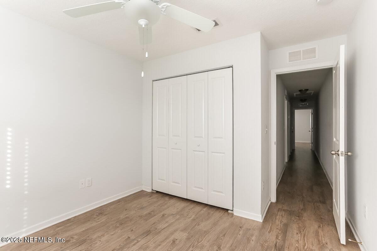 514 Eiseman Way Jacksonville, FL 32216 - Photo 13 of 15 a view of a hallway with wooden floor
