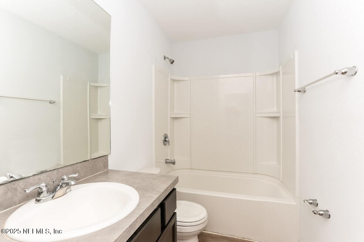 514 Eiseman Way Jacksonville, FL 32216 - Photo 14 of 15 a bathroom with a sink toilet and shower