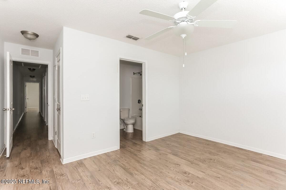 514 Eiseman Way Jacksonville, FL 32216 - Photo 7 of 15 a view of empty room with wooden floor
