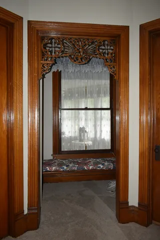 a bathroom with a bathtub and a window