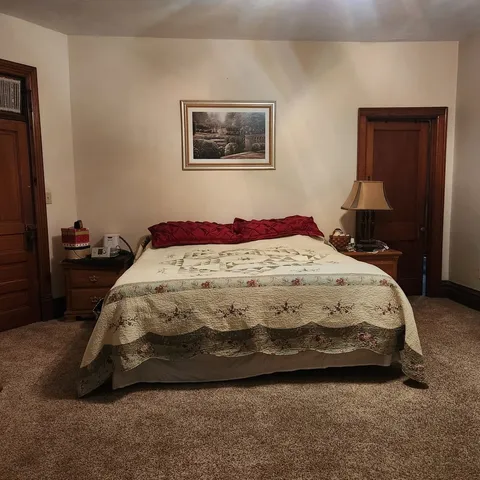 a view of wooden floor and windows in a room