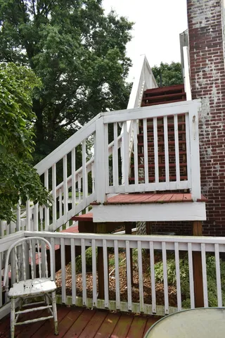 a front view of a house with a garden and yard