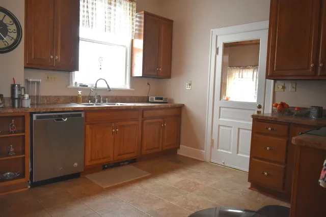 a kitchen with a sink and cabinets
