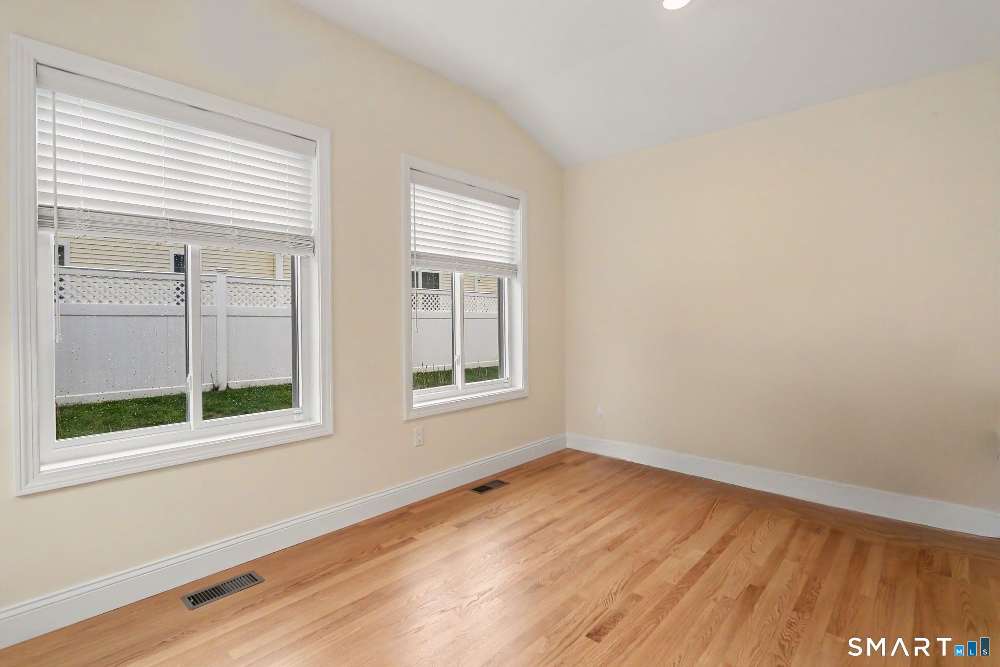 223 Meadow Brook Road, Unit 223 Oxford, CT 06478 - Photo 14 of 34 wooden floor in an empty room with a window