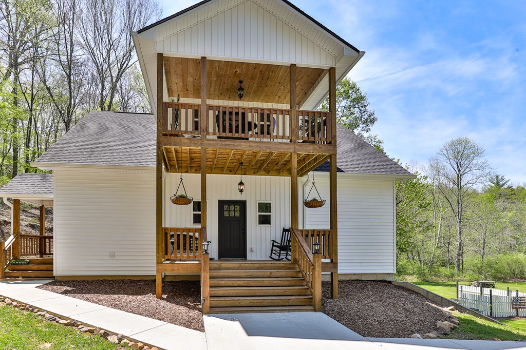 2001 Big Creek Road Ellijay, GA 30536 - Photo 13 of 73 a front view of a house with garden