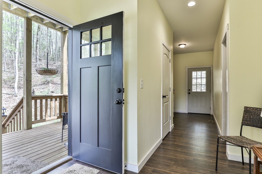 2001 Big Creek Road Ellijay, GA 30536 - Photo 25 of 73 a view of a hallway with wooden floor and windows