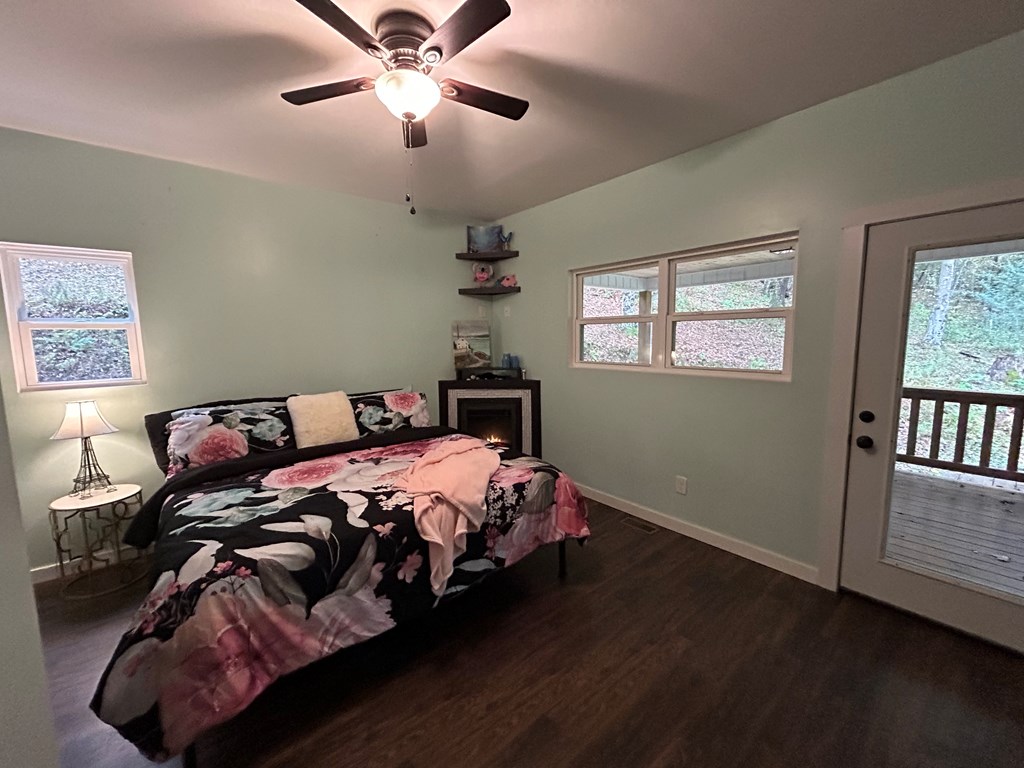 2001 Big Creek Road Ellijay, GA 30536 - Photo 29 of 73 a bedroom with a bed and wooden floor