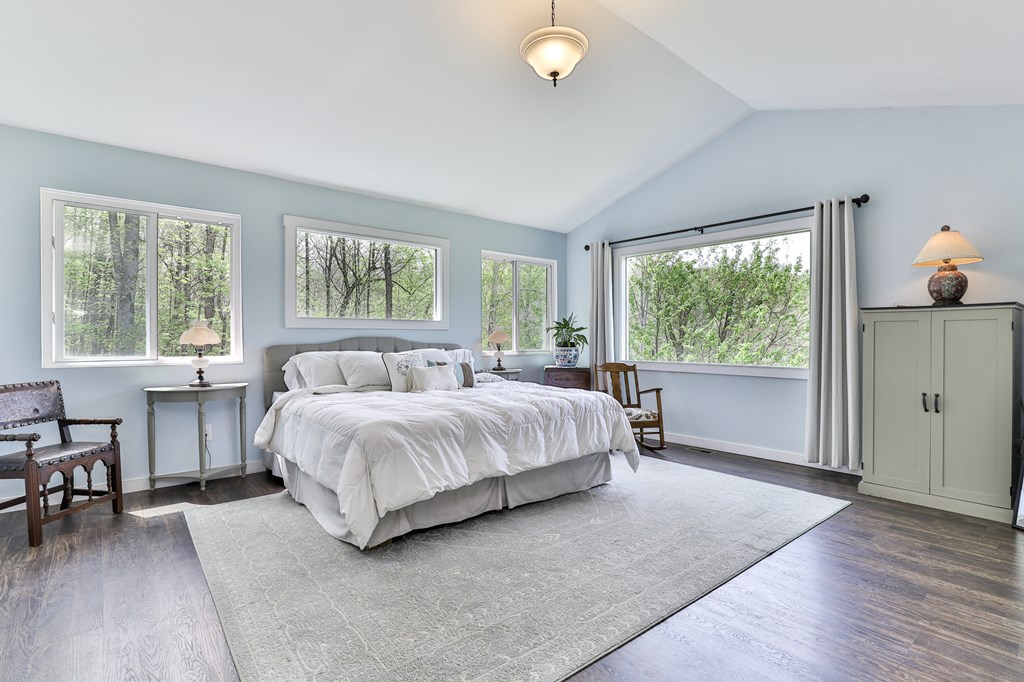 2001 Big Creek Road Ellijay, GA 30536 - Photo 32 of 73 a spacious bedroom with a bed and a table