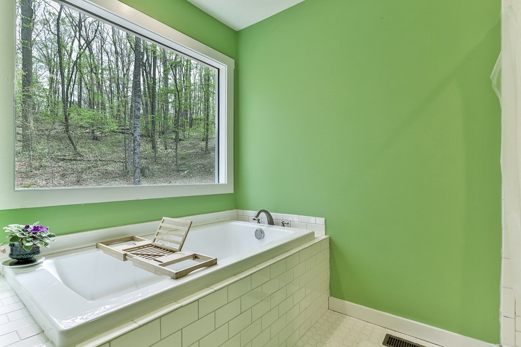 2001 Big Creek Road Ellijay, GA 30536 - Photo 41 of 73 a bath room with a sink and a mirror