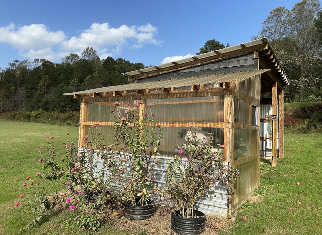 2001 Big Creek Road Ellijay, GA 30536 - Photo 58 of 73 a front view of a house with a garden