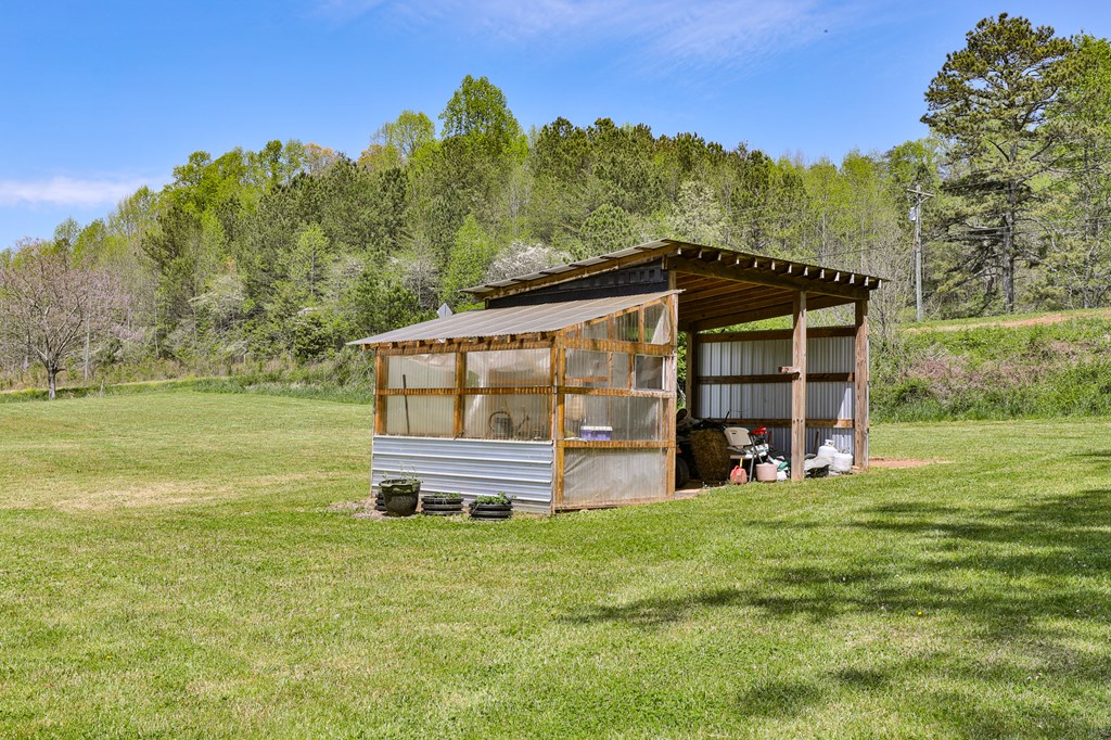 2001 Big Creek Road Ellijay, GA 30536 - Photo 60 of 73 a view of a big house with a big yard and large trees