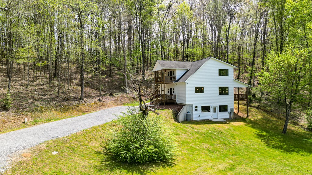2001 Big Creek Road Ellijay, GA 30536 - Photo 71 of 73 a view of a house with pool and sitting area