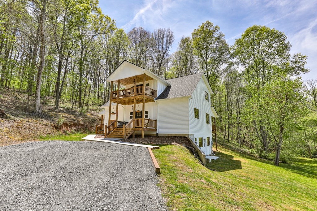 2001 Big Creek Road Ellijay, GA 30536 - Photo 10 of 73 a view of a house with swimming pool and sitting area