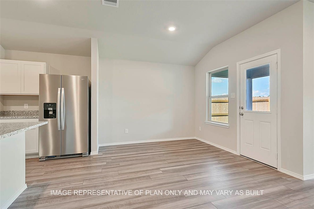 5425 Bear Run Bryan, TX 77807 - Photo 4 of 16 a view of an empty room with a kitchen