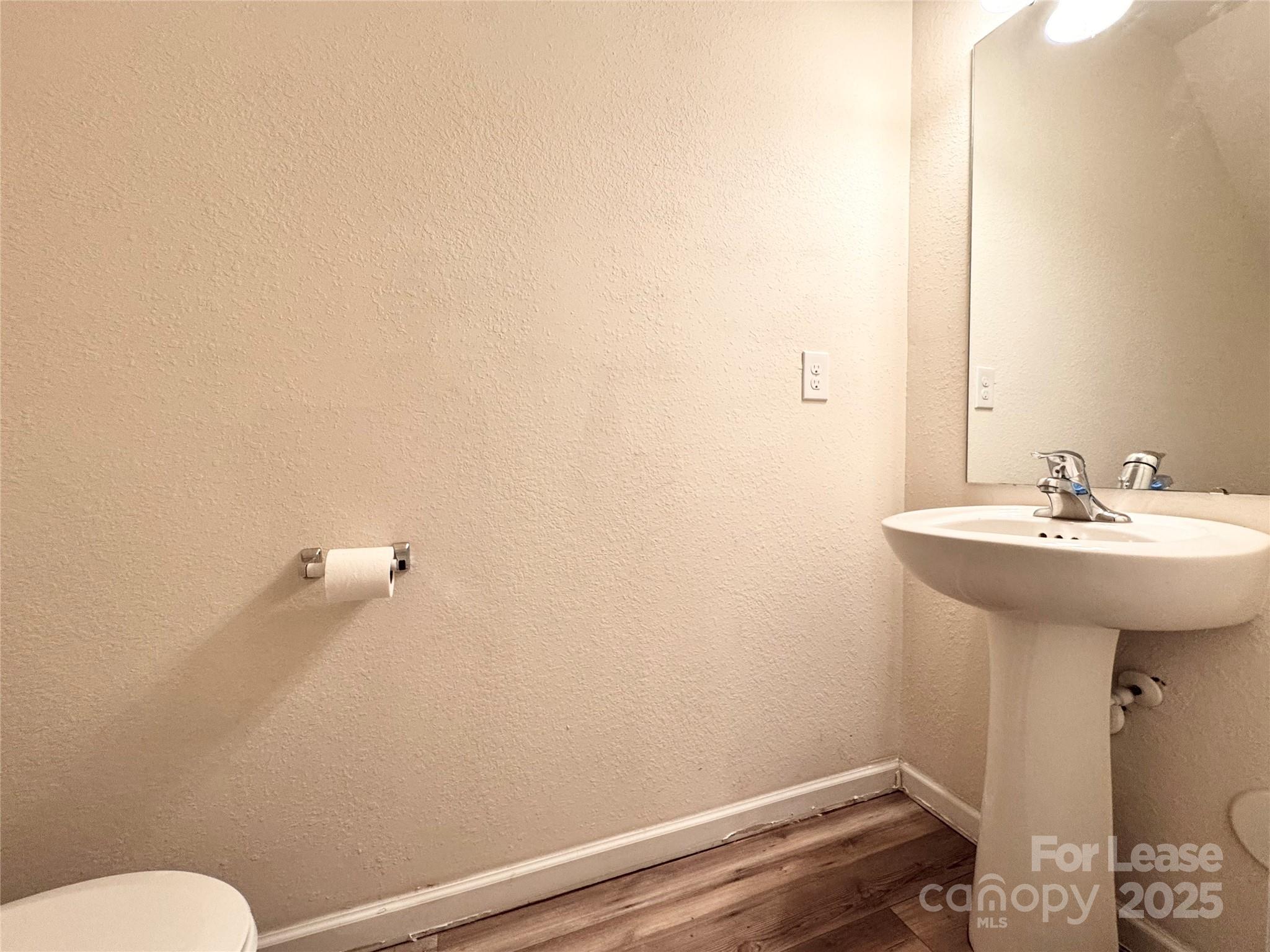 6717 Ware Road Charlotte, NC 28212 - Photo 18 of 22 a bathroom with a sink and a toilet