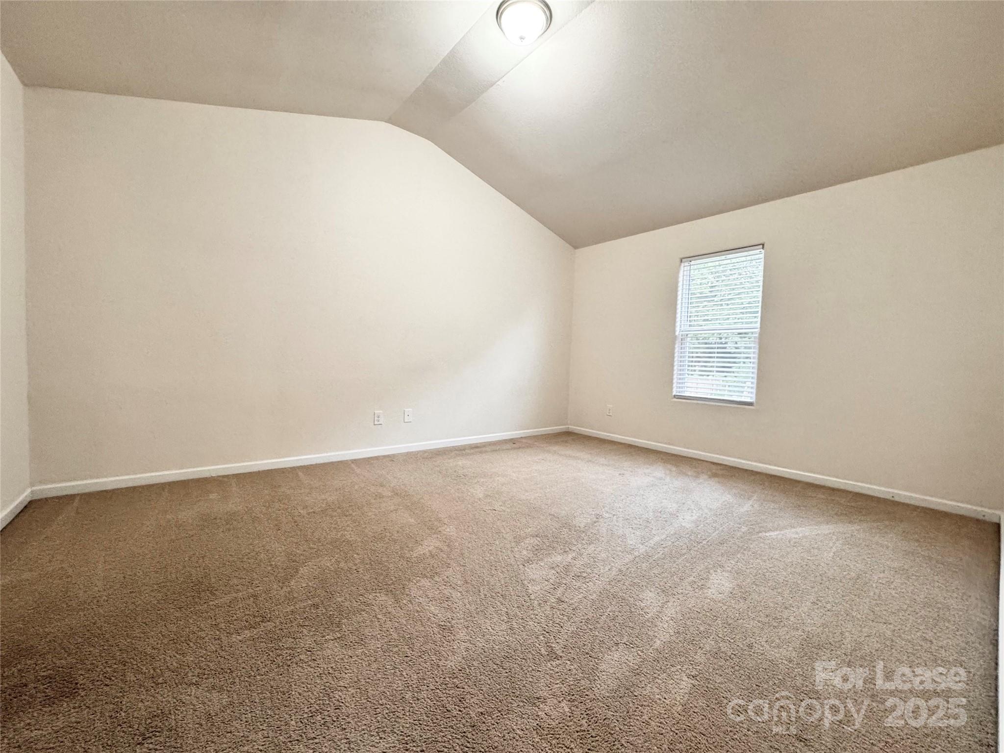 6717 Ware Road Charlotte, NC 28212 - Photo 10 of 22 an empty room with a window