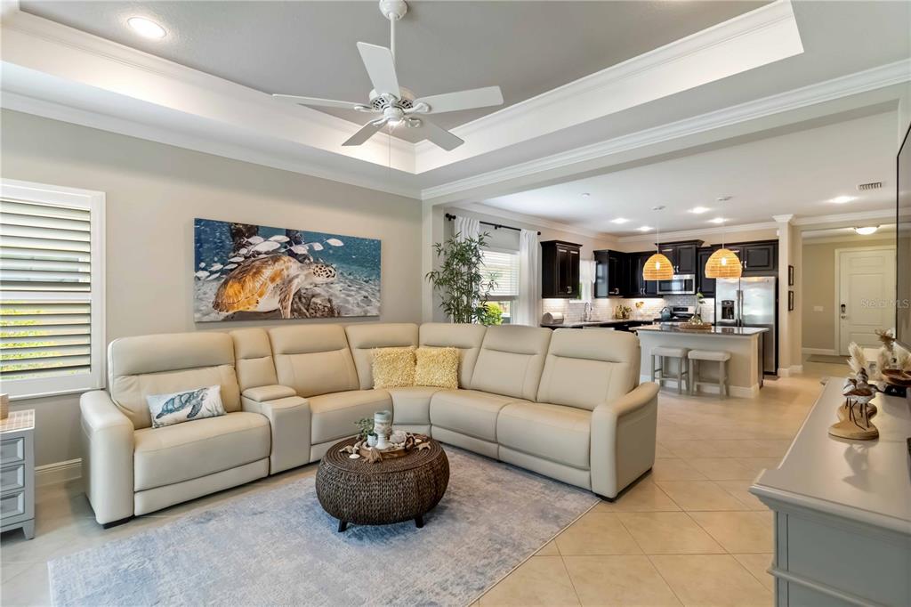 12252 Stuart Drive Venice, FL 34293 - Photo 11 of 70 a living room with furniture kitchen view and a chandelier