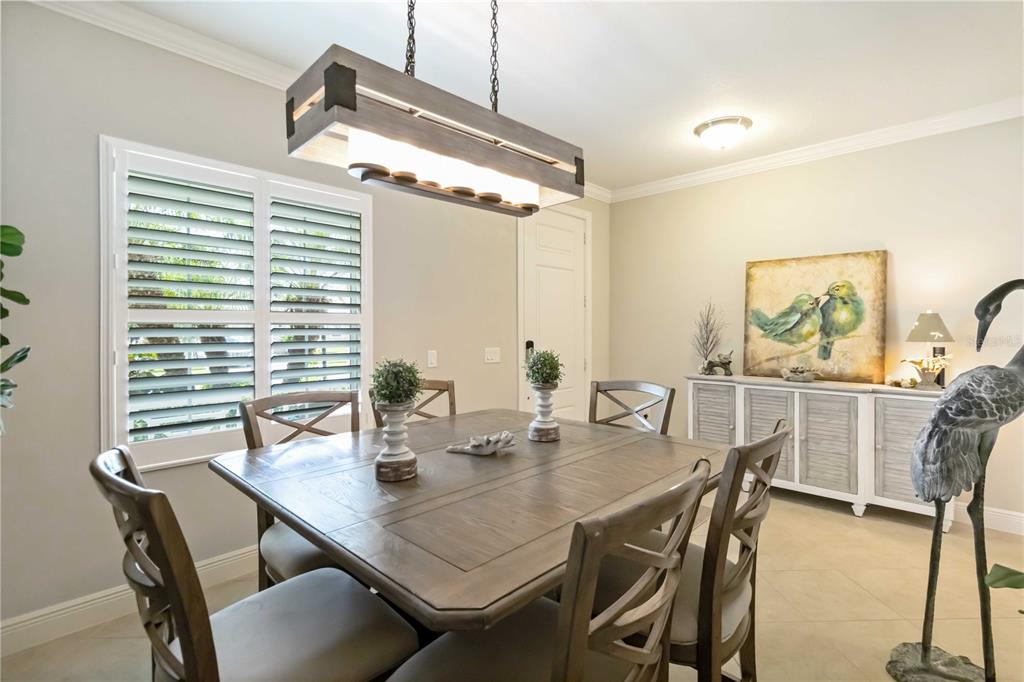 12252 Stuart Drive Venice, FL 34293 - Photo 18 of 70 a view of a dining room with furniture