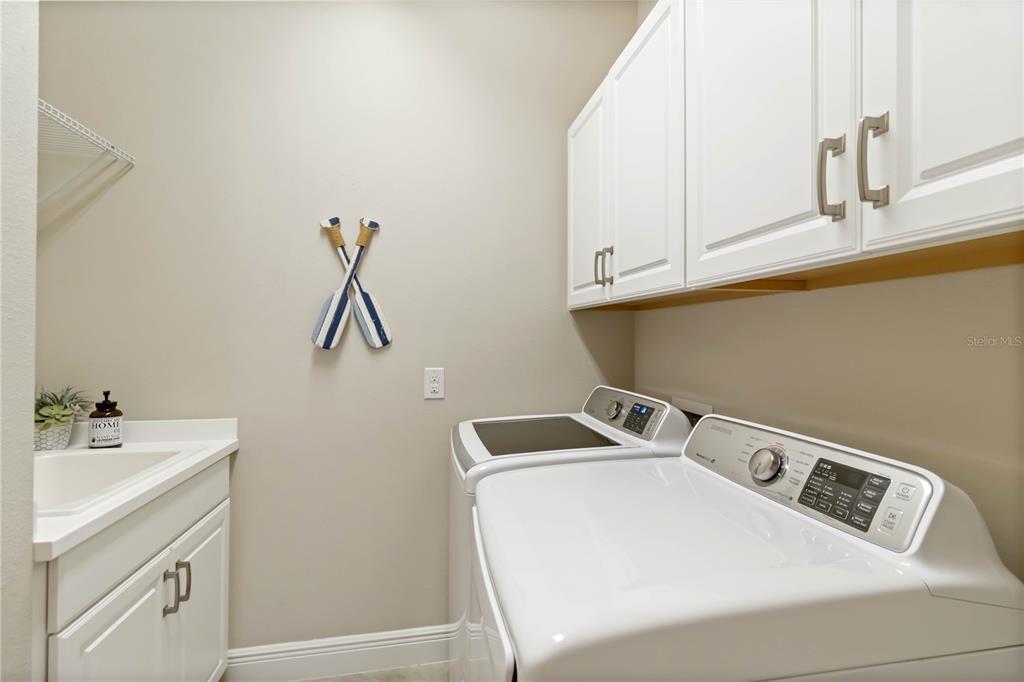 12252 Stuart Drive Venice, FL 34293 - Photo 27 of 70 a utility room with dryer and washer