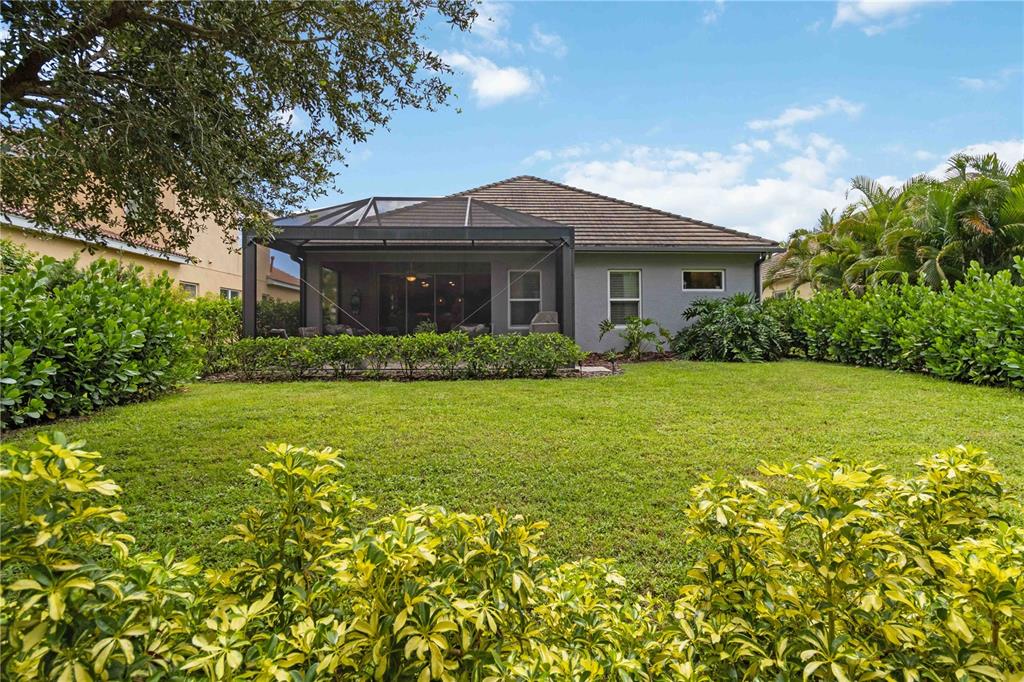 12252 Stuart Drive Venice, FL 34293 - Photo 41 of 70 a front view of house with yard and green space
