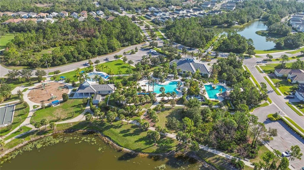 12252 Stuart Drive Venice, FL 34293 - Photo 48 of 70 an aerial view of residential houses with outdoor space and trees