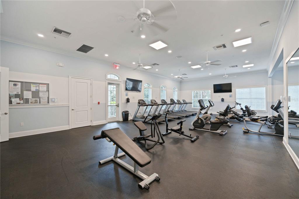 12252 Stuart Drive Venice, FL 34293 - Photo 54 of 70 a view of a room with gym equipment and a table