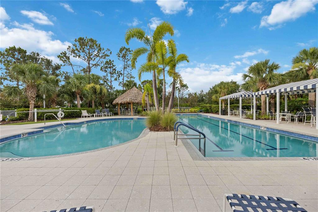 12252 Stuart Drive Venice, FL 34293 - Photo 60 of 70 a view of a swimming pool with a patio