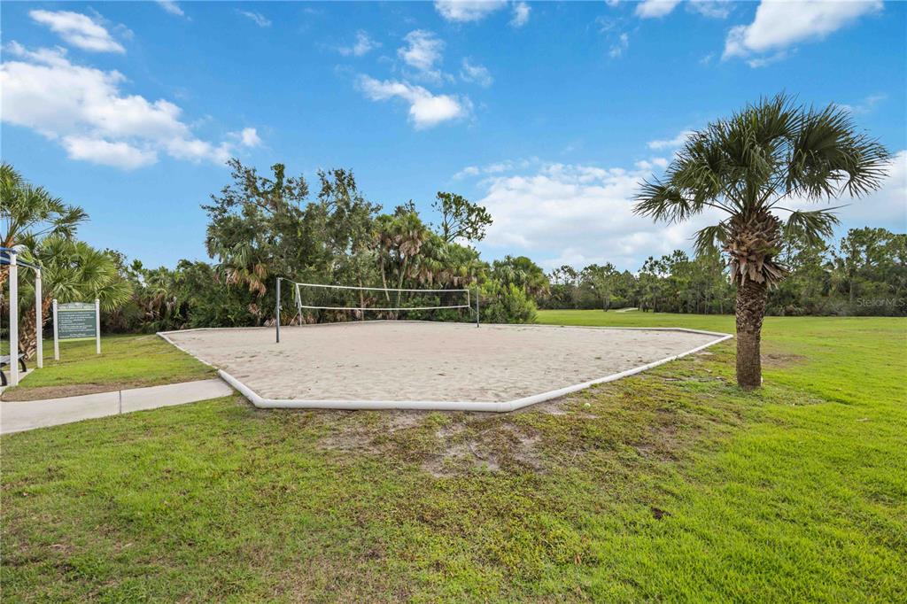 12252 Stuart Drive Venice, FL 34293 - Photo 66 of 70 a view of a swimming pool with a yard