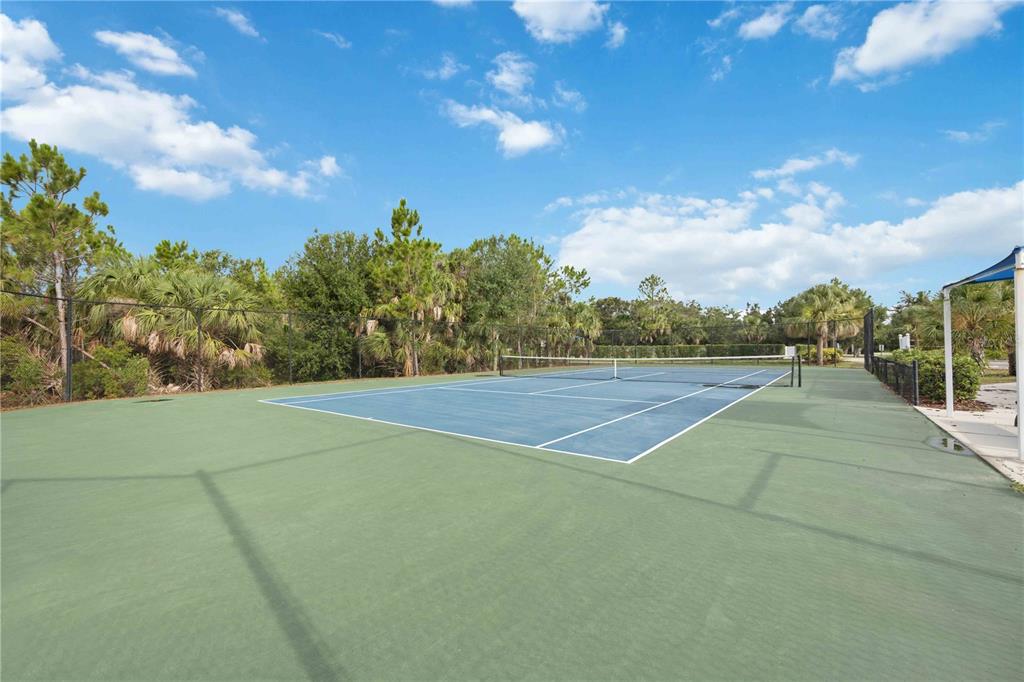 12252 Stuart Drive Venice, FL 34293 - Photo 70 of 70 a view of an outdoor space and tennis court